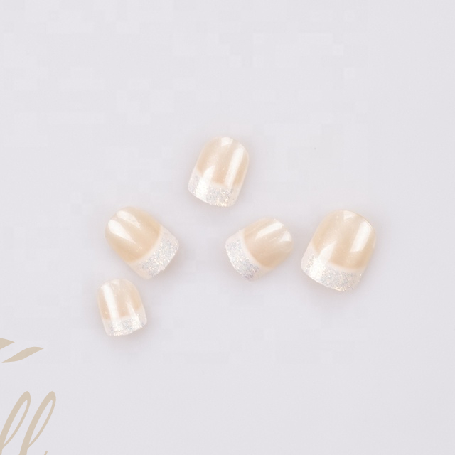 The latest trend is pale orange French artificial nails